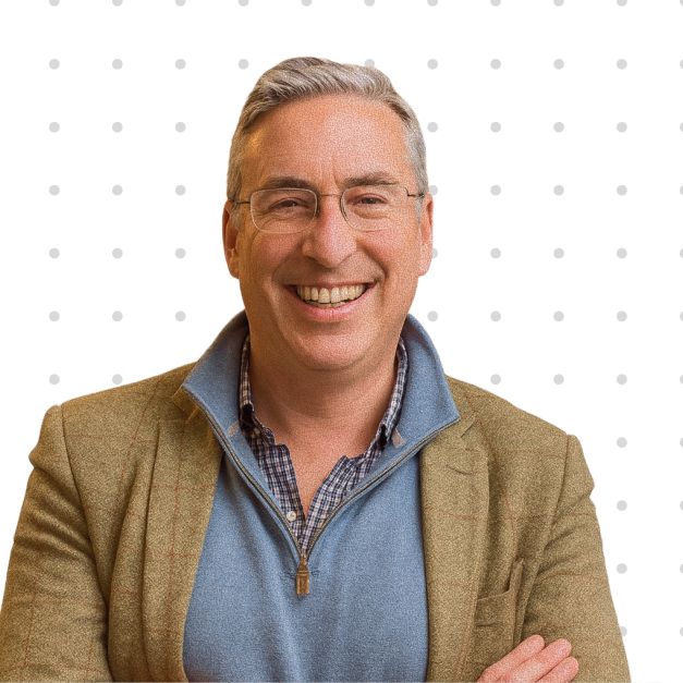 Julian Chesterfield, CTO of hosted·ai, smiling in a blazer and sweater, featured in a webinar replay about GPU-as-a-Service strategies.